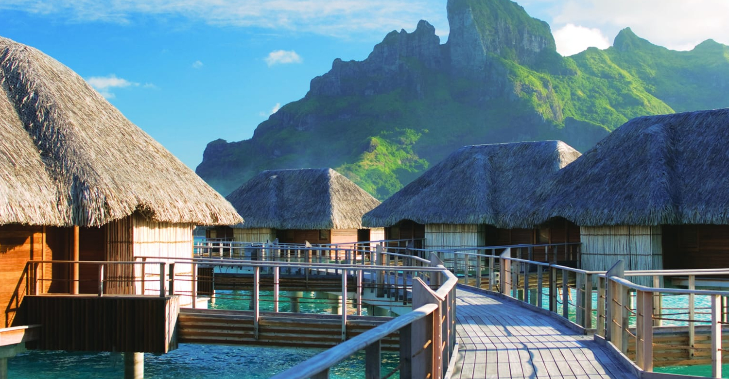 Bungalows view the green peak of Mount Otemanu | Credit: Four Seasons Resort Bora Bora