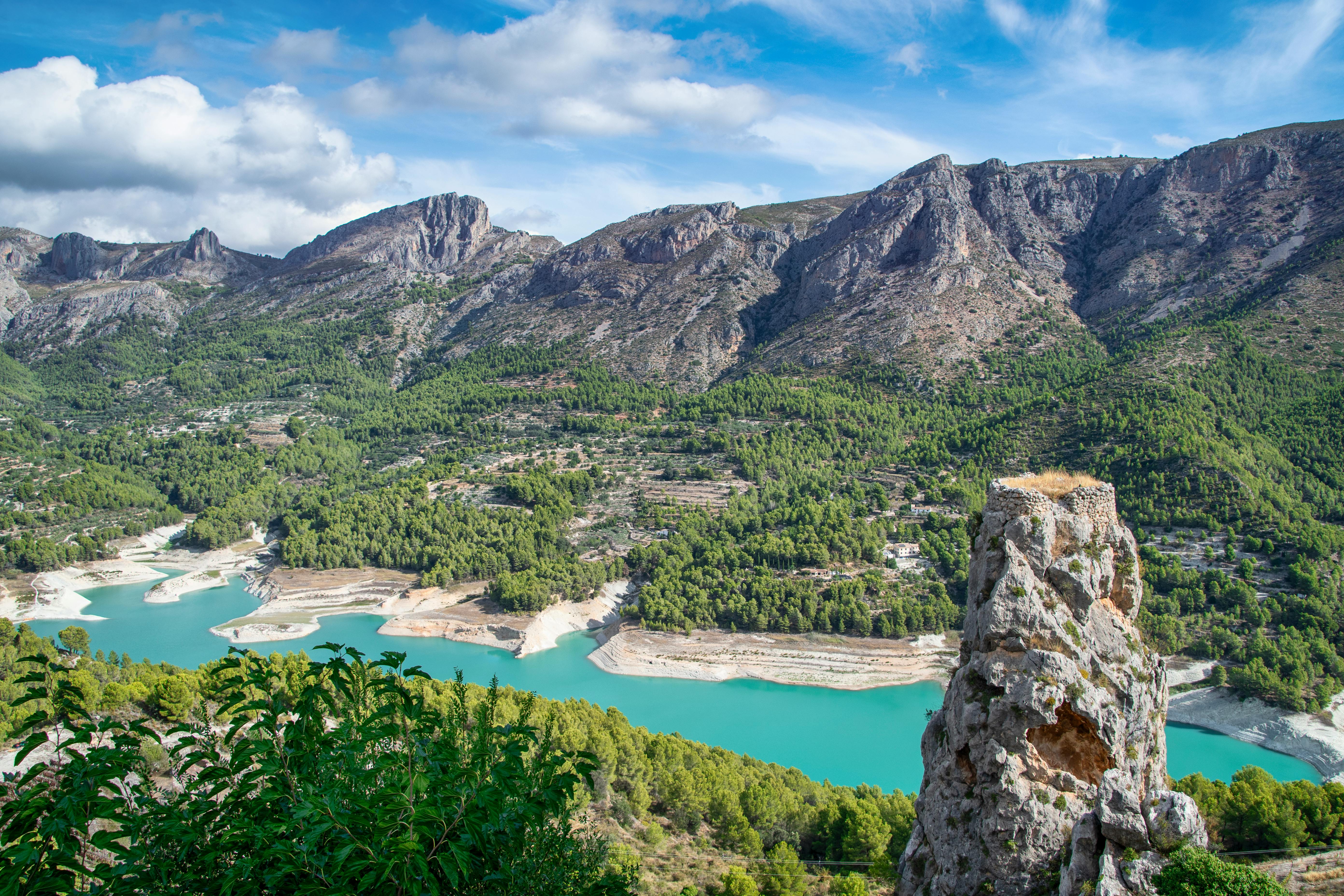 A panoramic view of Guadalest Valley reveals emerald hills