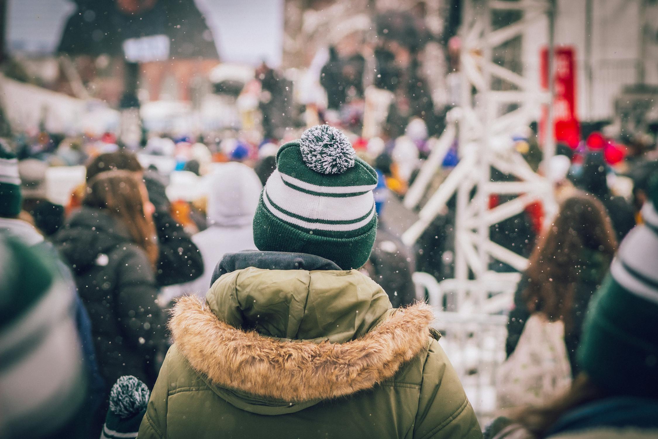 Man at a festival in winter clothes