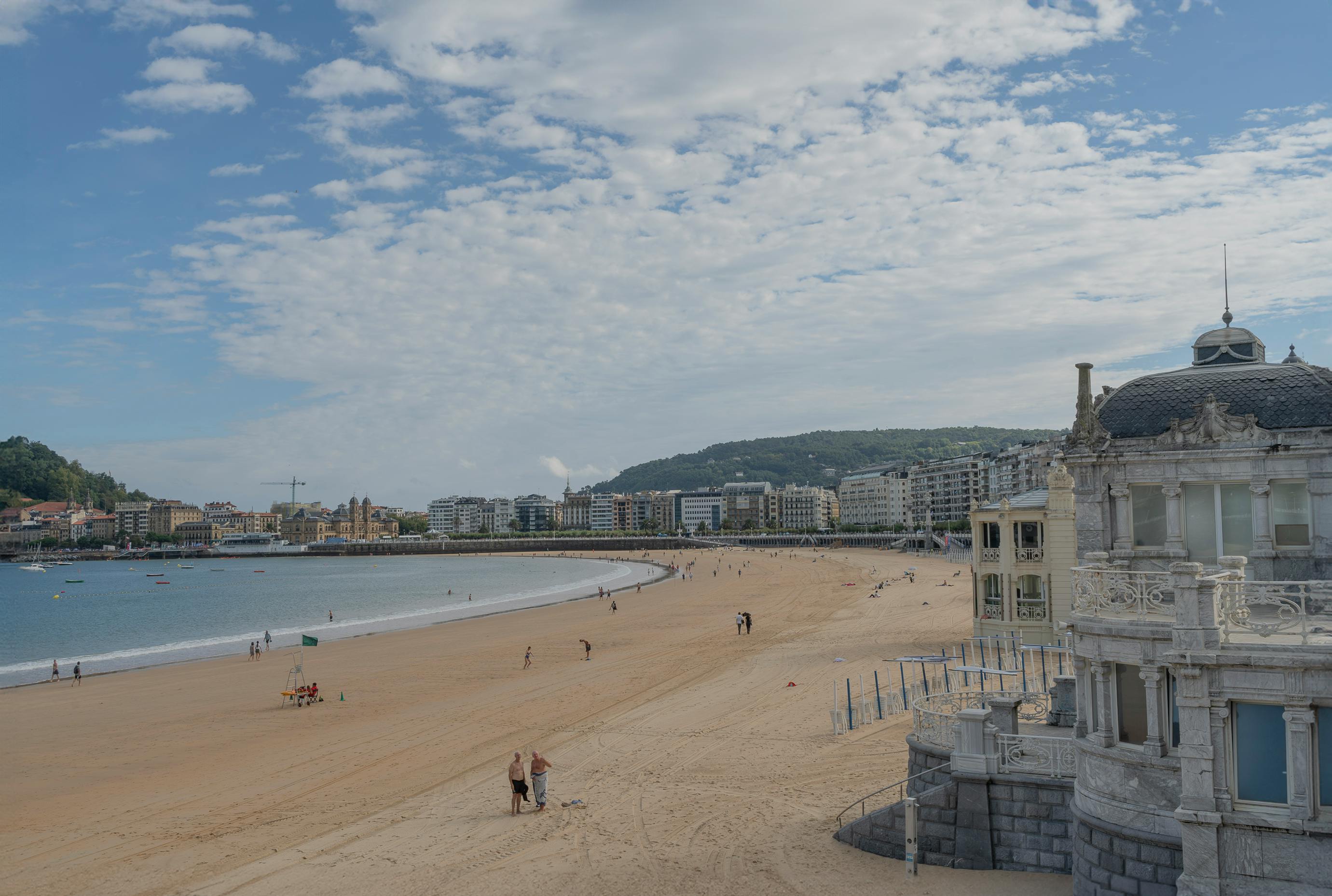 A sunlit beachfront in San Sebastián