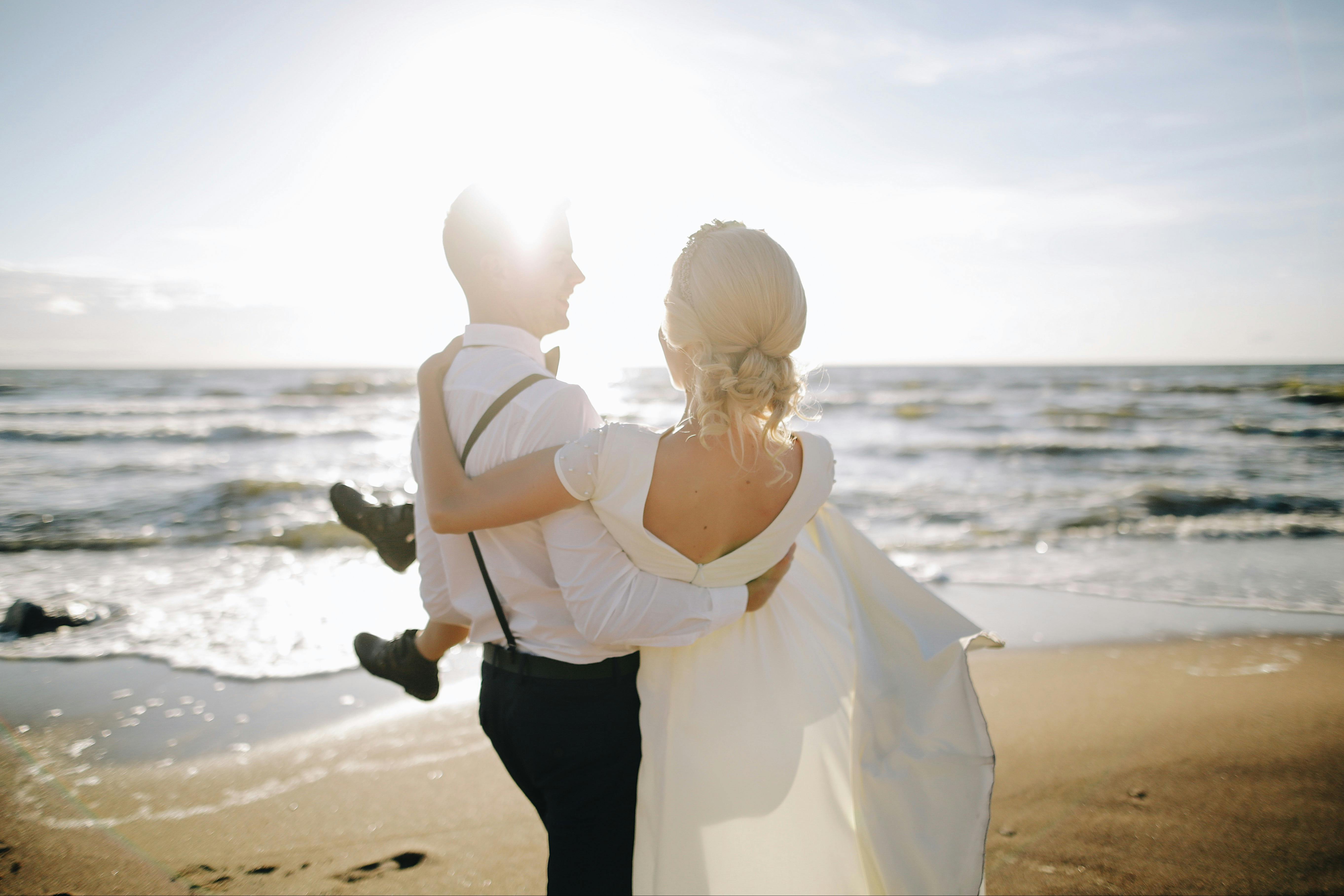 A joyful couple shares a carefree moment on the beach