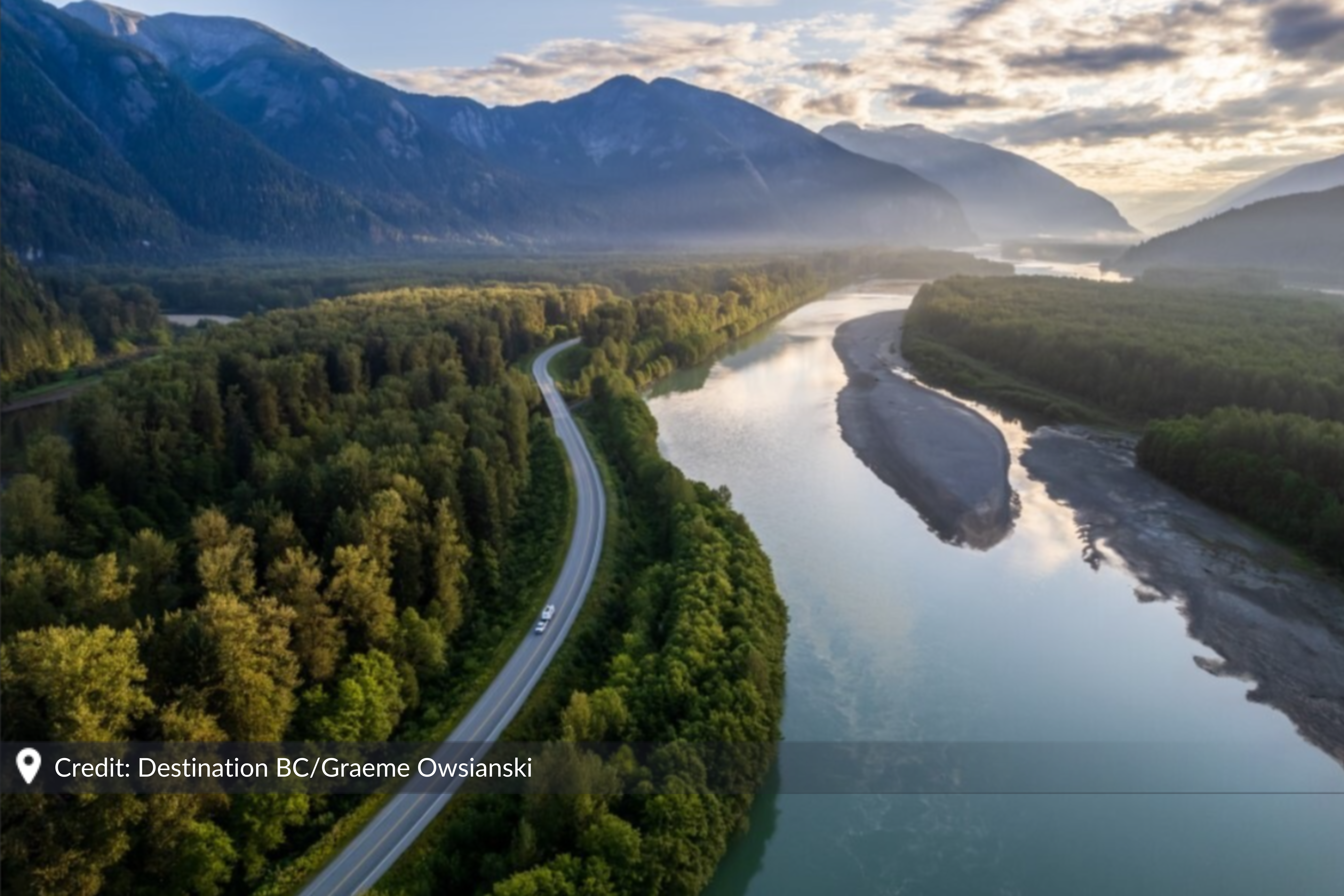 A winding coastal highway stretches through the wilderness of British Columbia