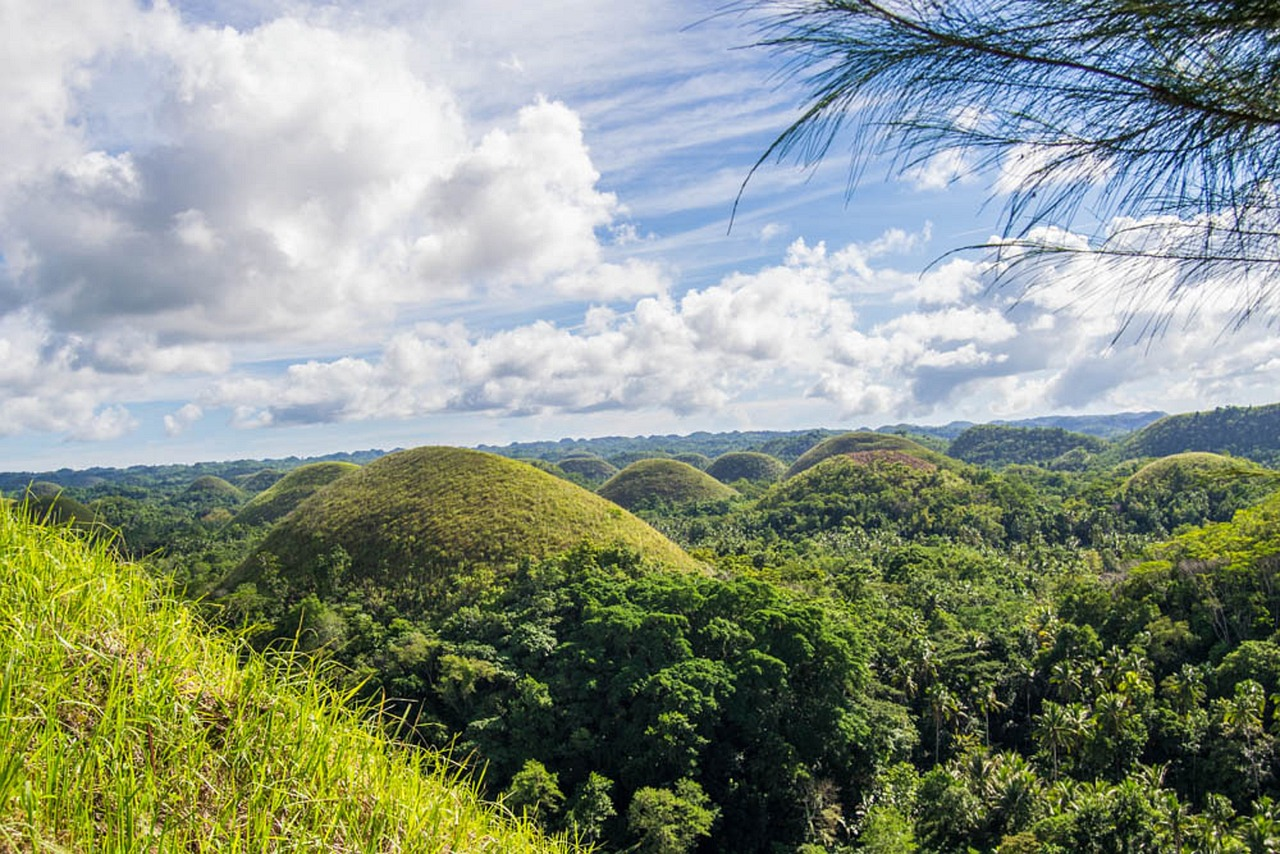 The iconic Chocolate Hills on a sunny day.