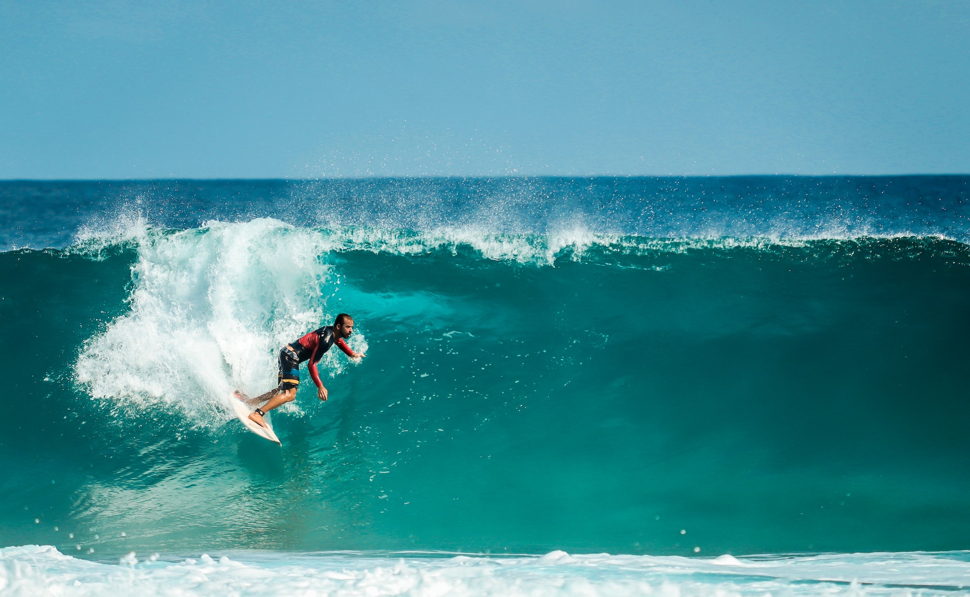 a man surfing big waves