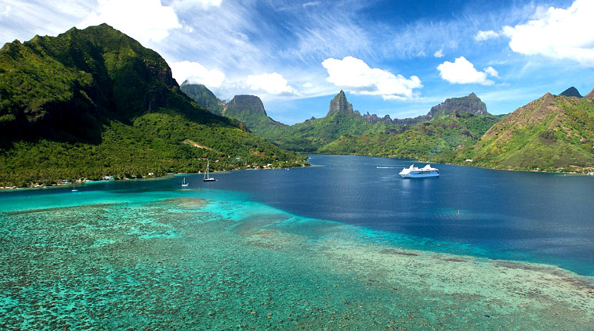 The Islands of Tahiti are signified by sublime natural surroundings of white sand beaches and lush mountains.