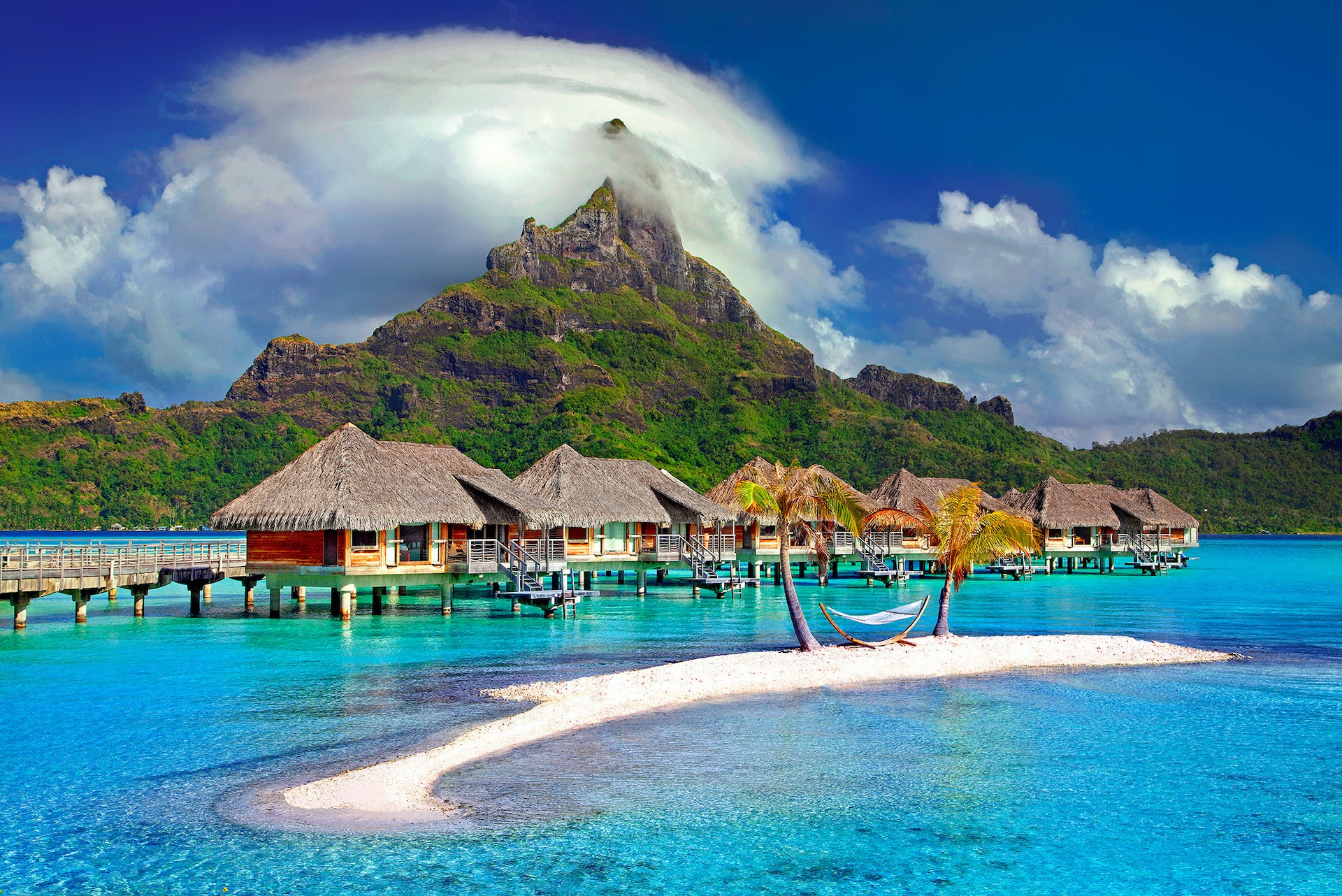 cottages in the middle of a beach