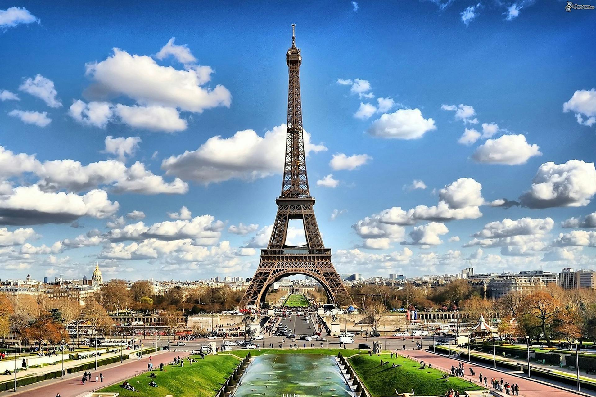 The Eiffel Tower with trees and buildings surrounding it