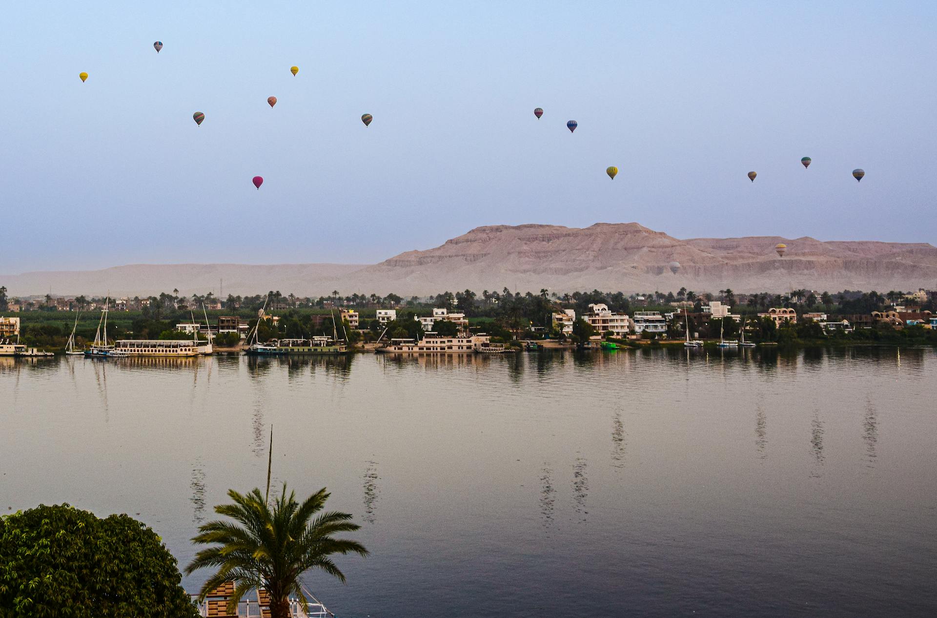 Hot air balloons floating above the Nile in Egypt.