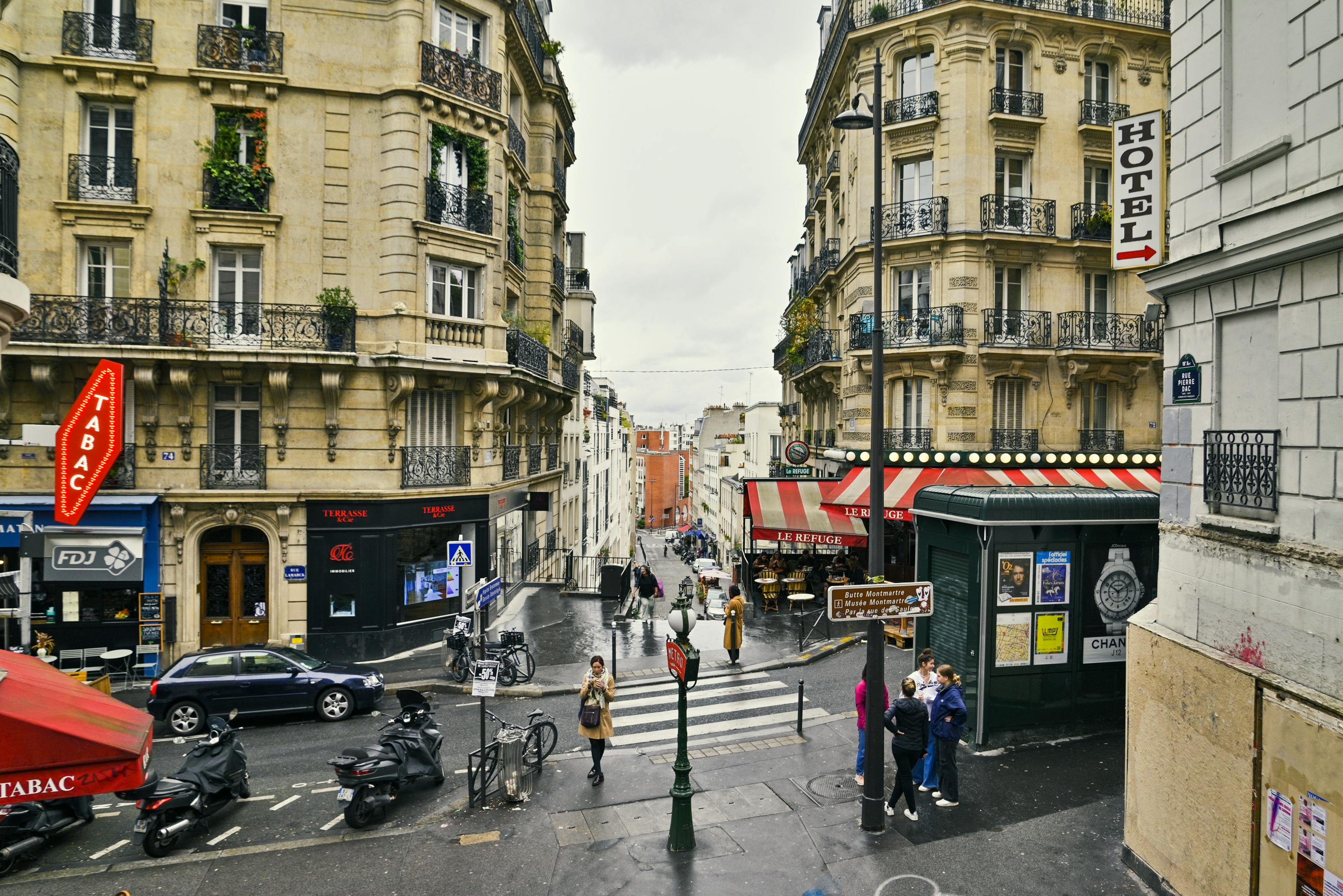 A charming street in Montmartre lined with pastel façades and cobblestones