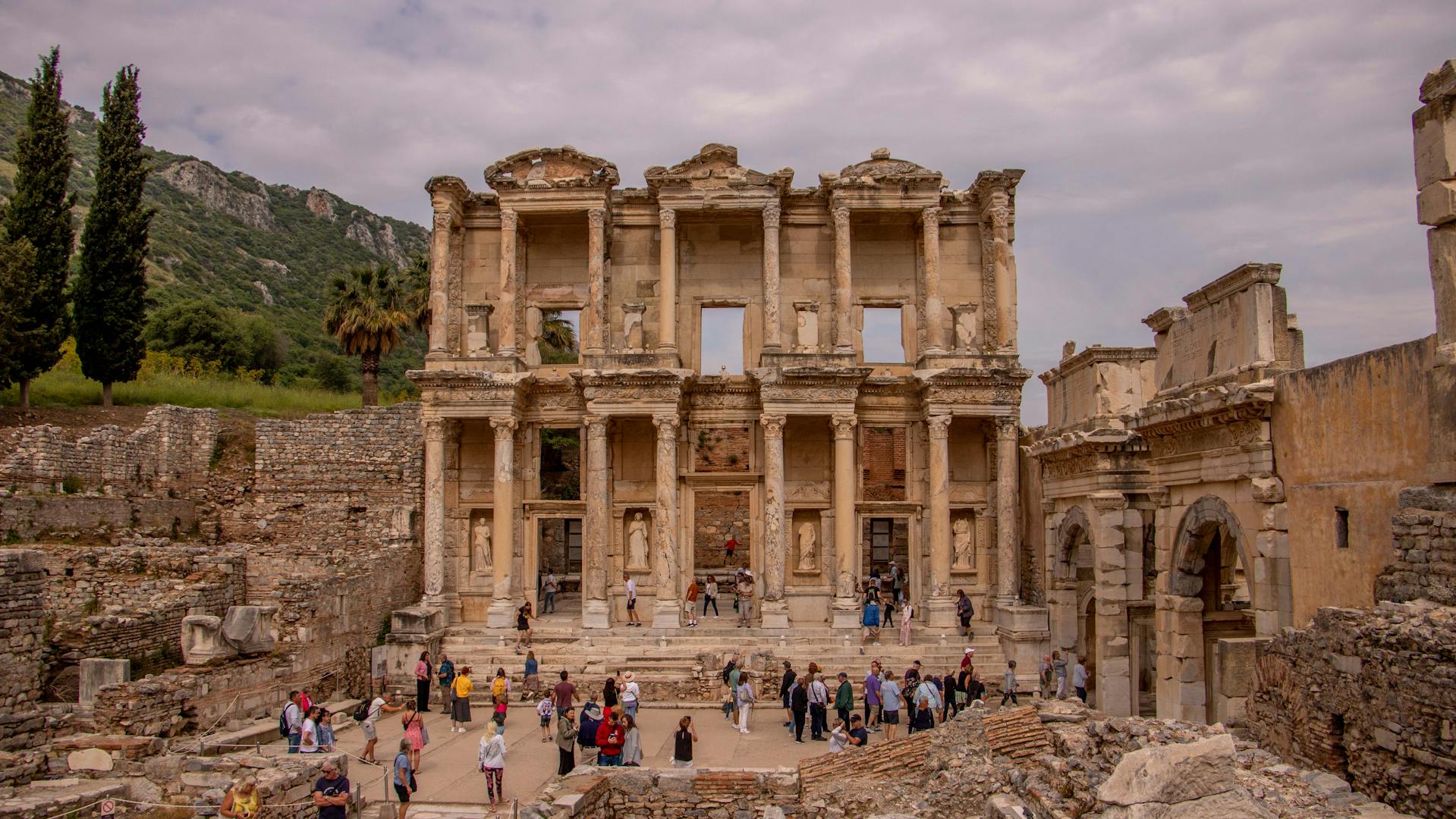 Visitors admiring the ruins of the Library of Celsus