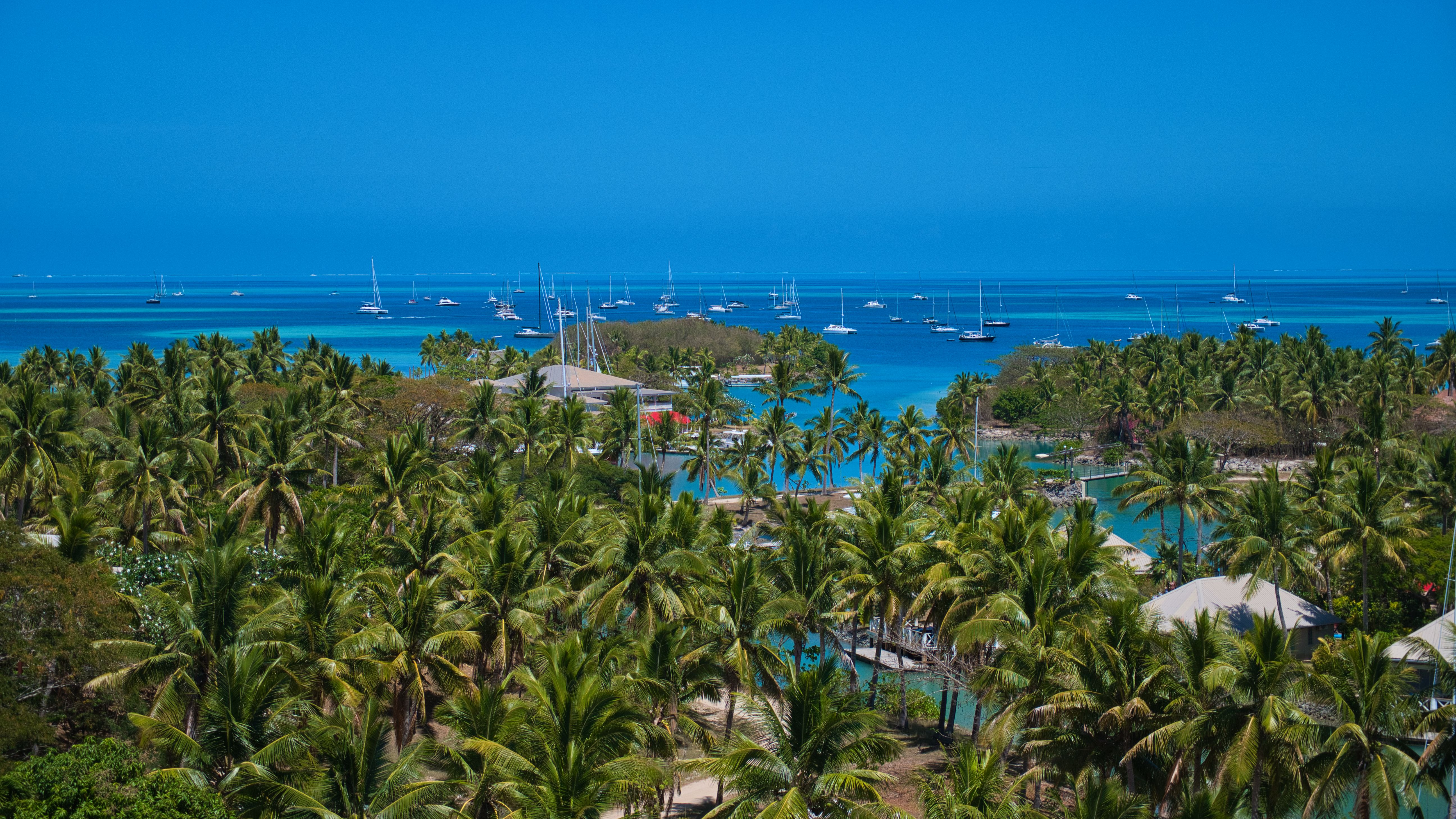 Aerial view of Fiji's tropical islands surrounded by turquoise lagoons, coral reefs and pristine South Pacific waters