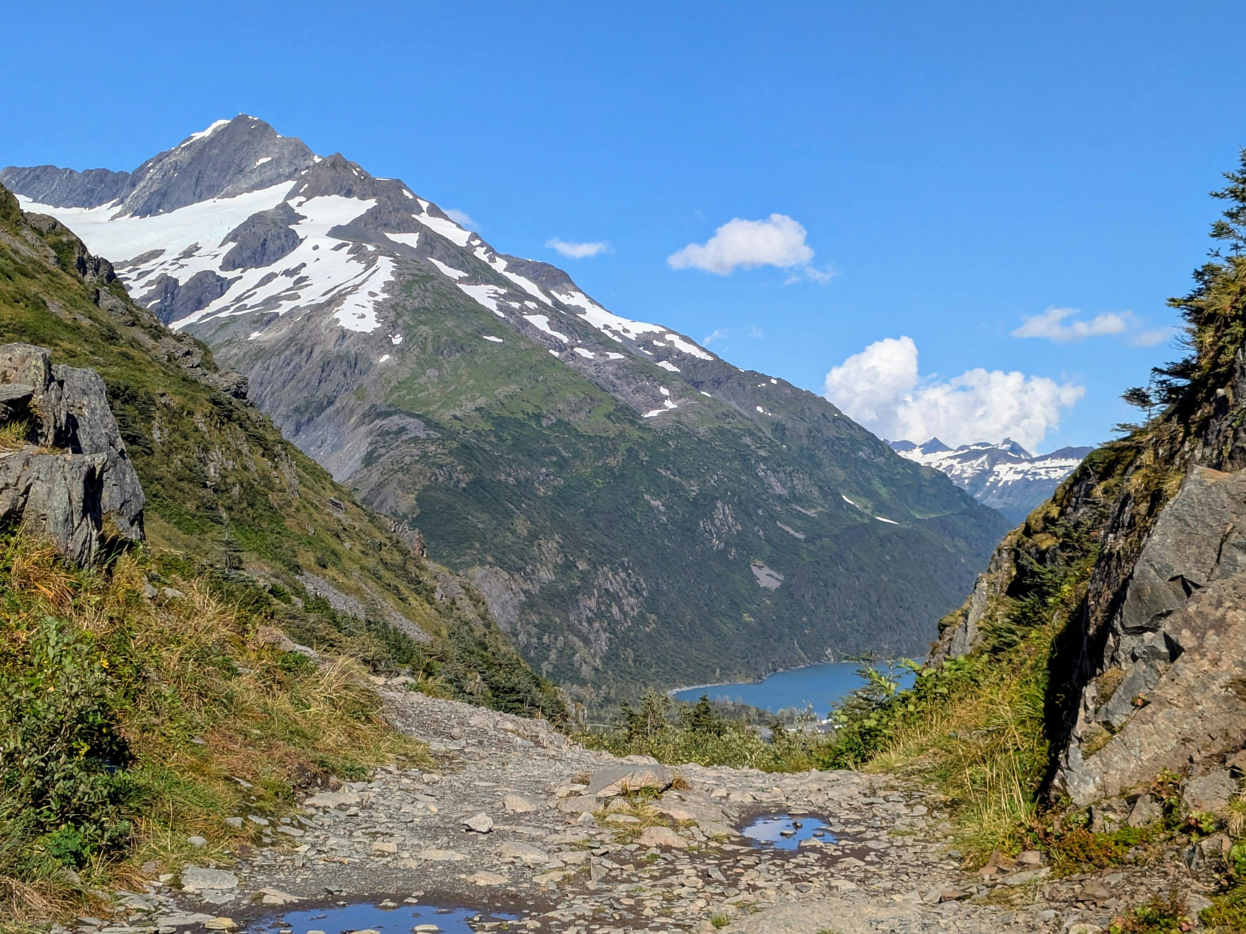 Snow-capped peaks rise over Alaska’s rugged landscape