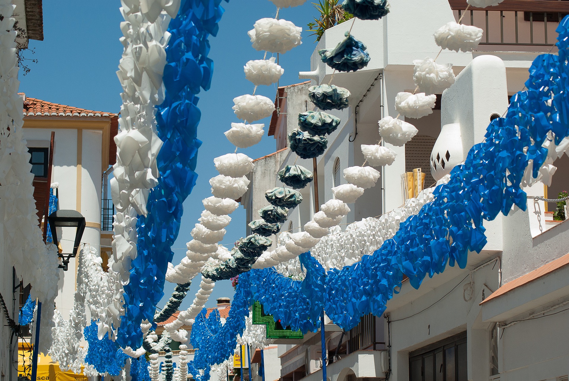 festival decorations hanging above a street