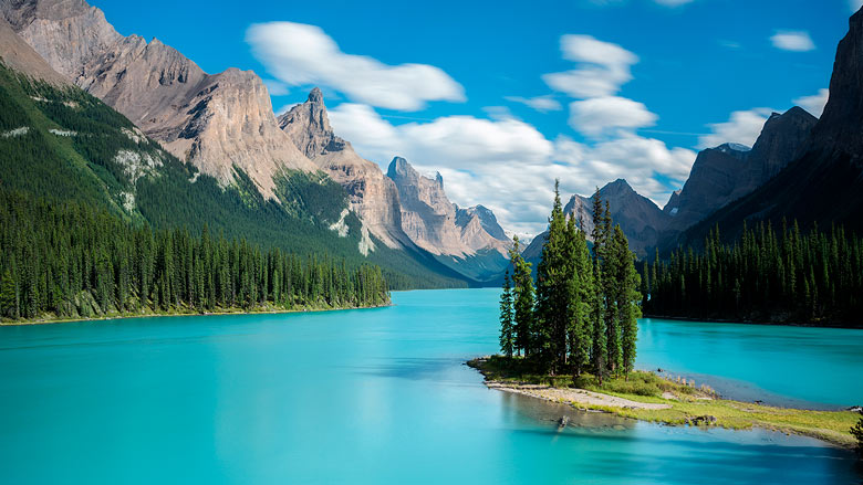 Cruise the azure waters of Maligne Lake