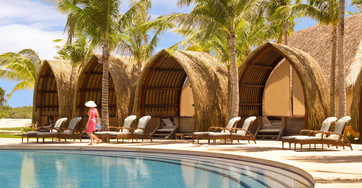 Thatched-roof pool cabanas | Credit: Four Seasons Resort Bora Bora