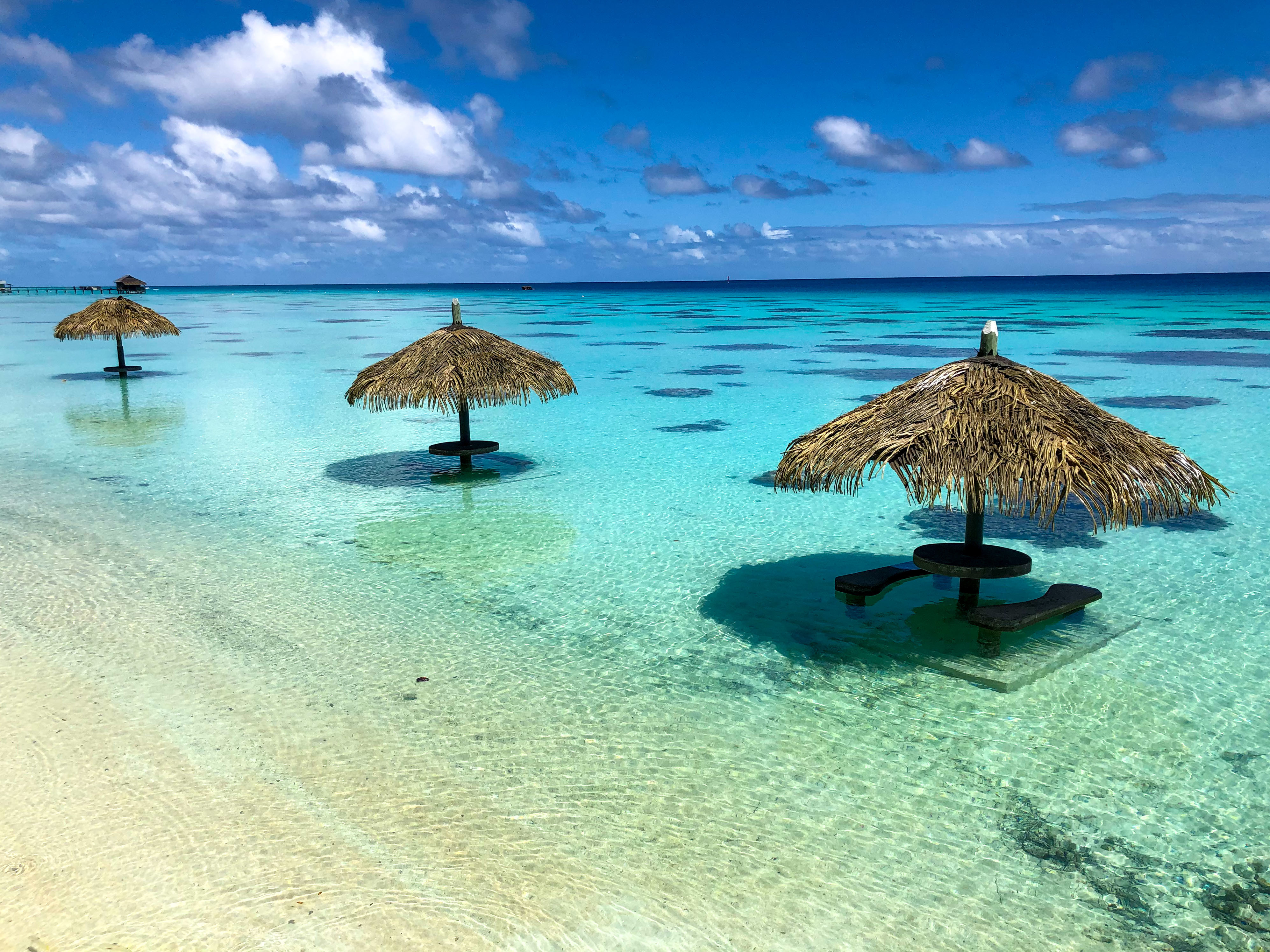 Beach umbrellas in a lagoon