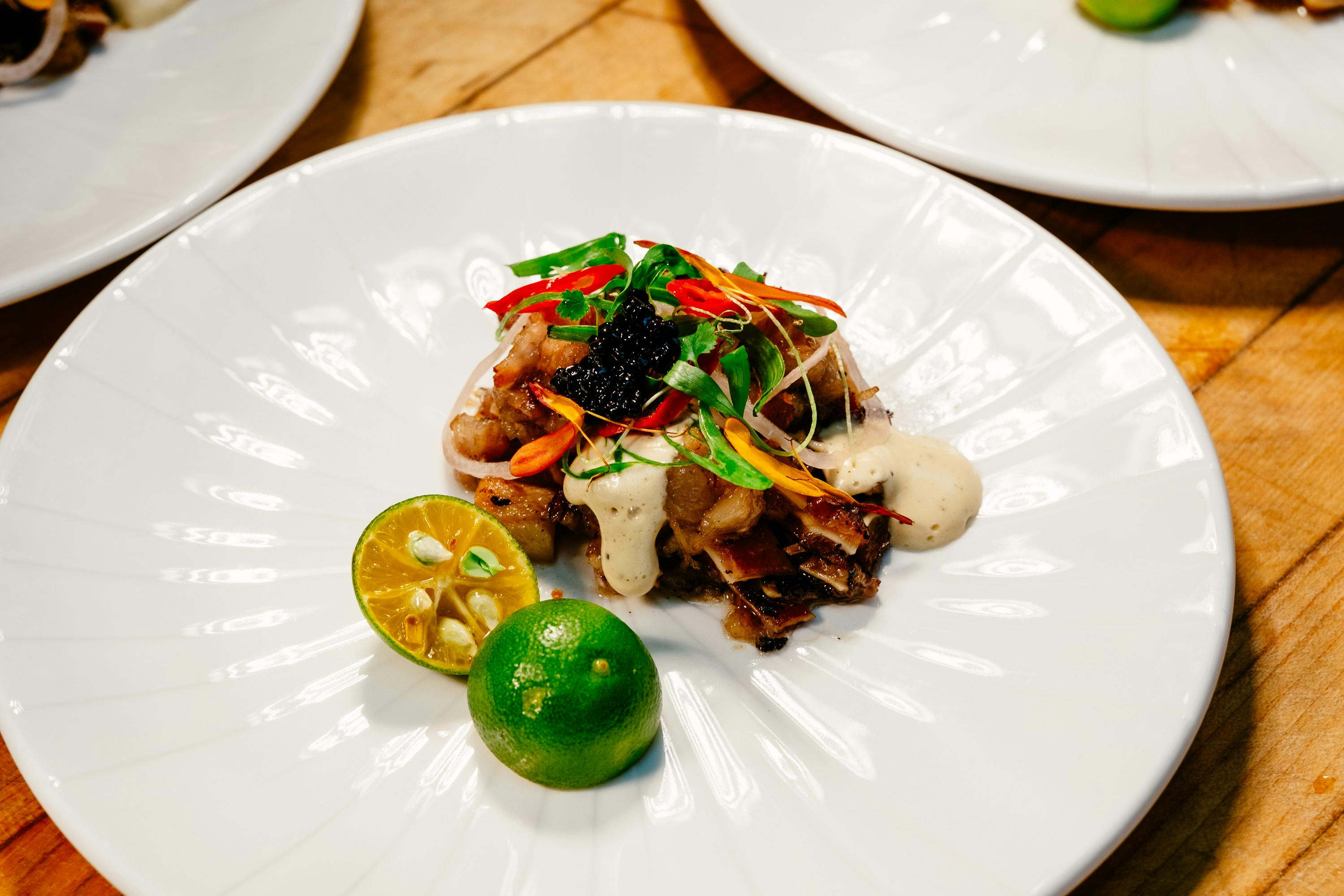 Exquisite Sisig Dish with Citrus Garnish